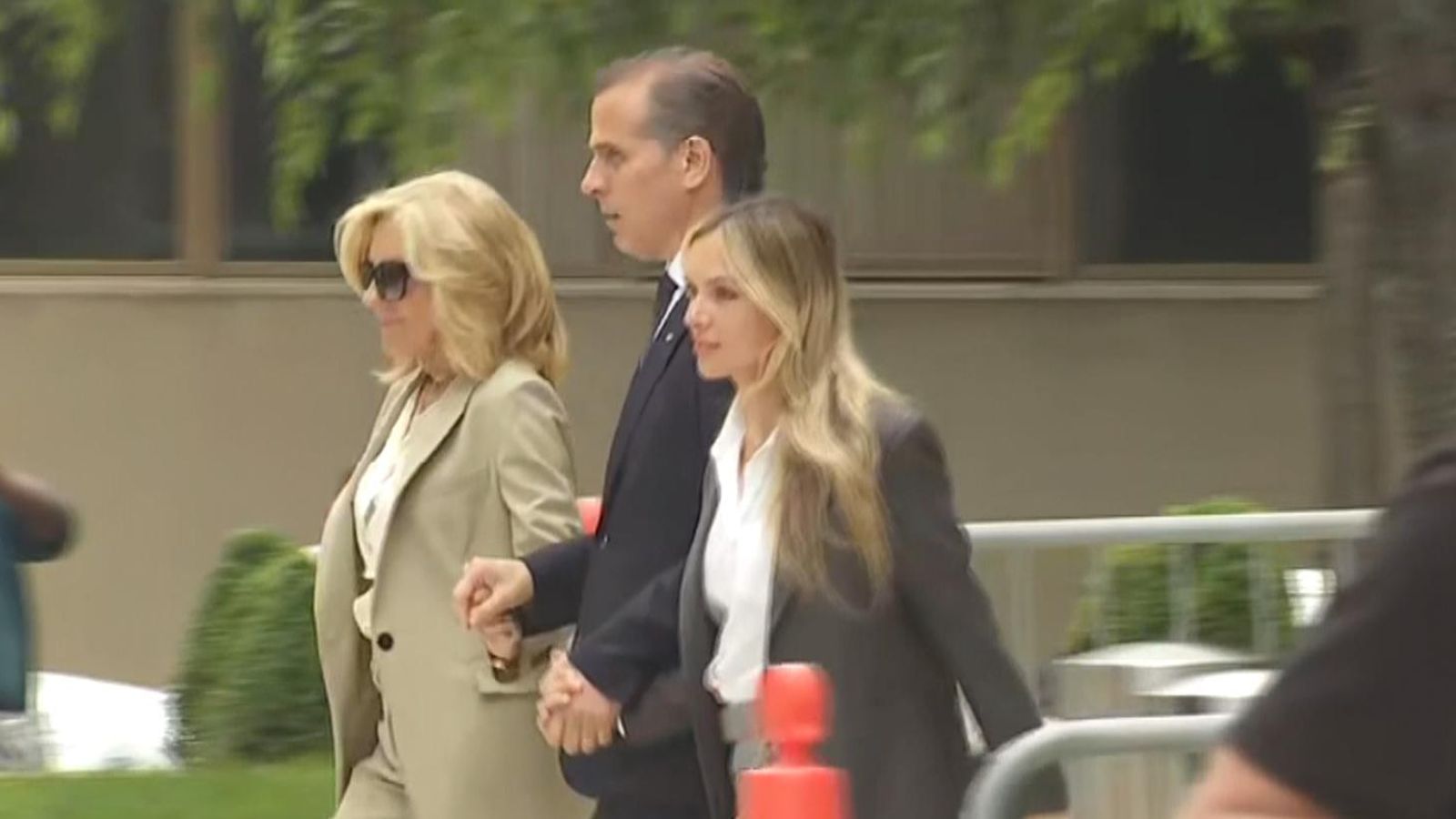 Hunter Biden holds Jill Biden’s hand as he leaves court after guilty