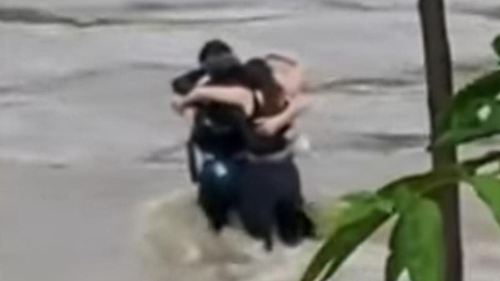 Three friends seen hugging before being swept away by floodwaters in Italy