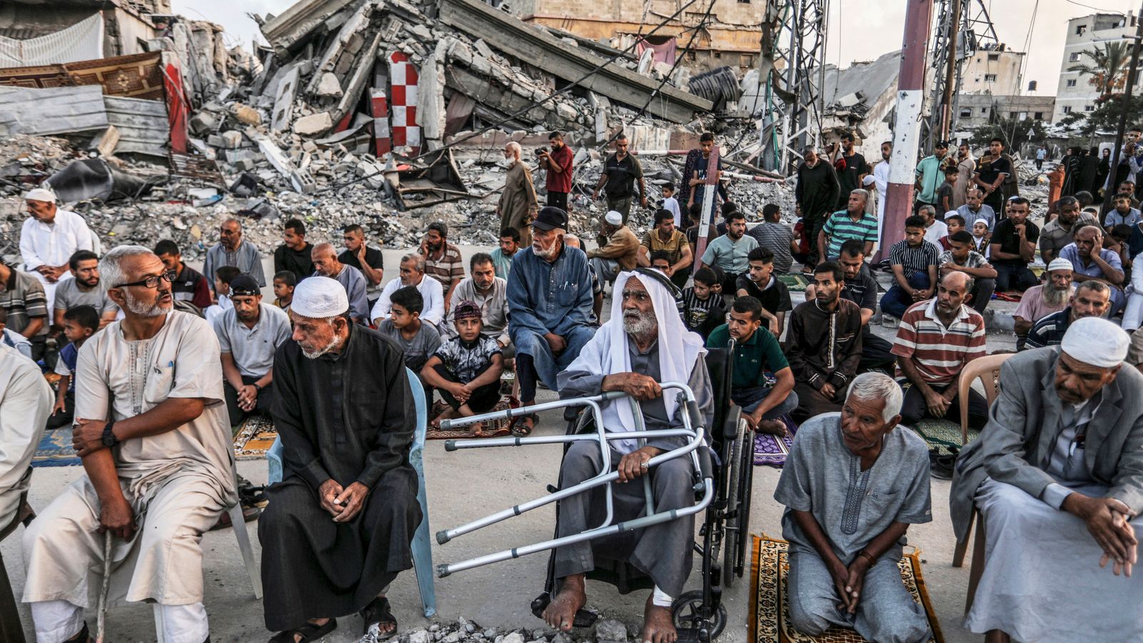 Palestinians gather at ruined mosque for Eid al Adha prayers - as Muslims celebrate around the world