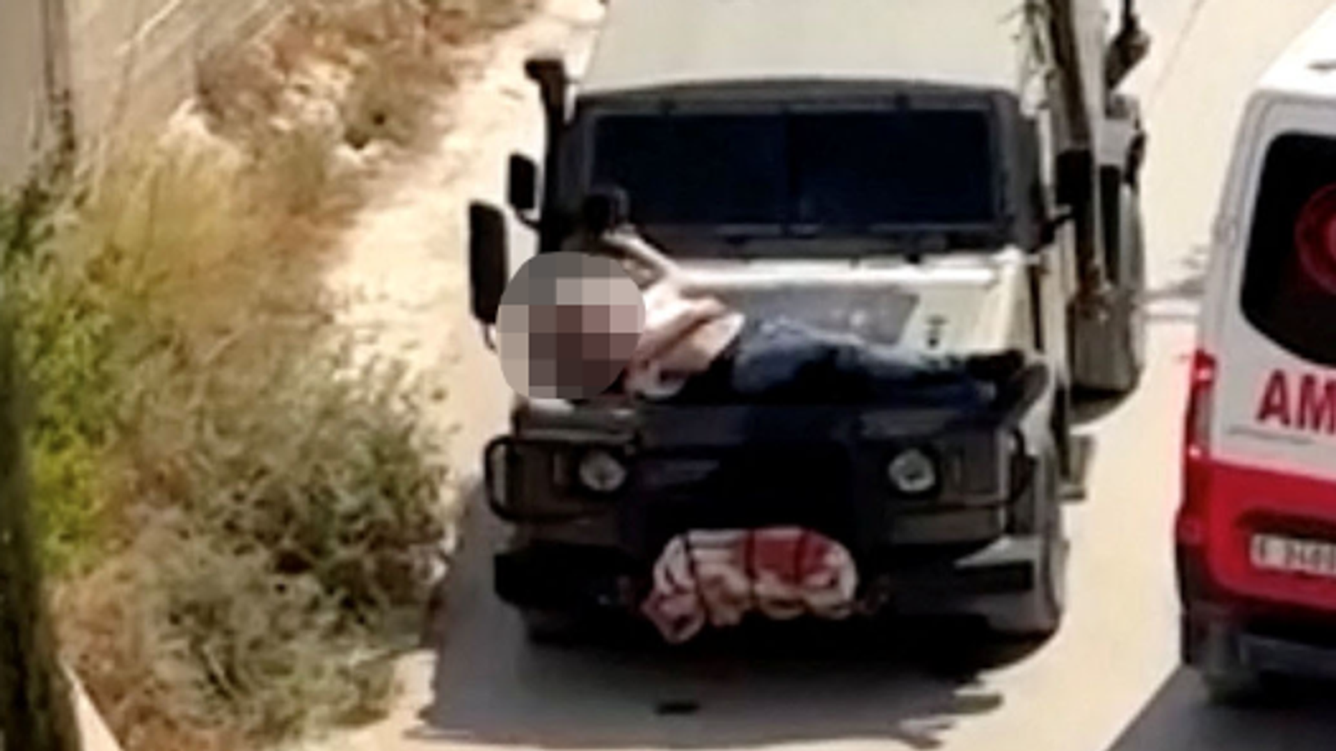 Israeli soldiers strapped injured Palestinian to jeep