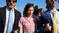 Amanda Knox arrives flanked by her husband Christopher Robinson, right, at the Florence courtroom in Florence, Italy.
Pic: AP