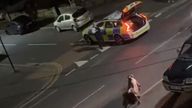 The video shows a cow being hit by a police car twice