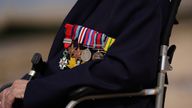 Veteran Donald Jones displays his medals as he returns to Sword Beach in Normandy, France. Pic: PA