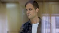 Wall Street Journal reporter Evan Gershkovich stands inside an enclosure for defendants before a court hearing to consider an appeal against his pre-trial detention on espionage charges in Moscow, Russia, October 10, 2023. Pic: Reuters 