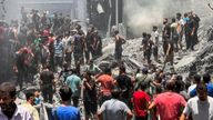 Palestinians search for casualties at the site of Israeli strikes on houses in Al Shati refugee camp. Pic: Reuters