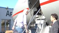 Julian Assange boards his flight out of the UK Pic: Wikileaks