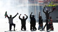 Demonstrators react as police use tear gas to disperse protesters during a demonstration against Kenya's proposed finance bill 2024/2025 in Nairobi, Kenya, June 25, 2024. REUTERS/Monicah Mwangi