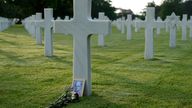 Flowers are left at the grave of a US World War II soldier at the Normandy American Cemetery in Colleville-sur-Mer. Pic: AP Photo/Virginia Mayo