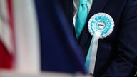 A person wearing a Reform UK rosette. Pic: PA