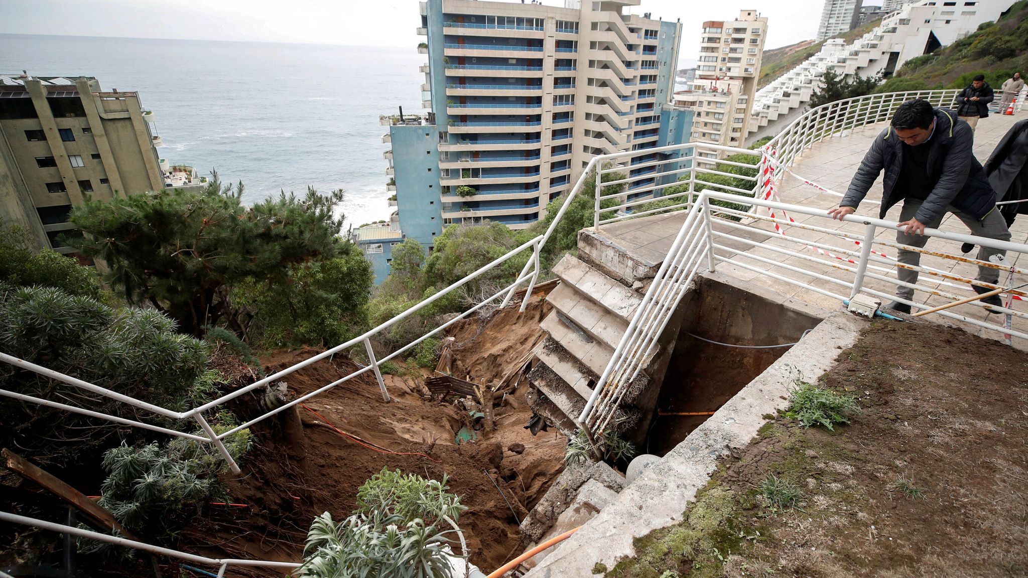 Chilean residents live in fear as homes stand precariously above ...