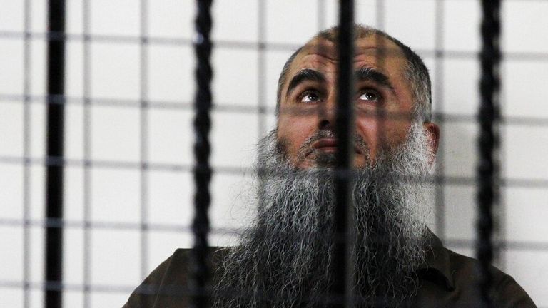 Pic: AP. The radical al-Qaida-linked preacher Abu Qatada sits behind bars at the Jordanian military court in Amman, Jordan, Thursday, June 26, 2014. 