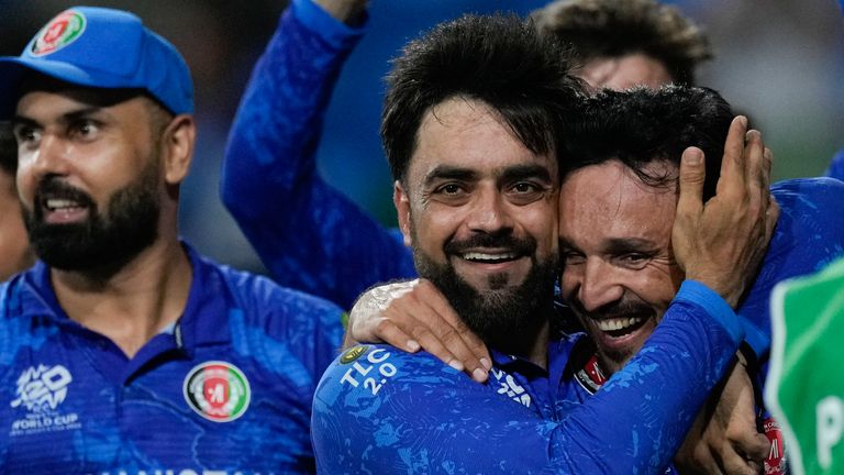 Afghanistan's captain Rashid Khan, centre, embraces teammate Gulbadin Naib as they celebrate after defeating Bangladesh by eight runs. Pic: AP