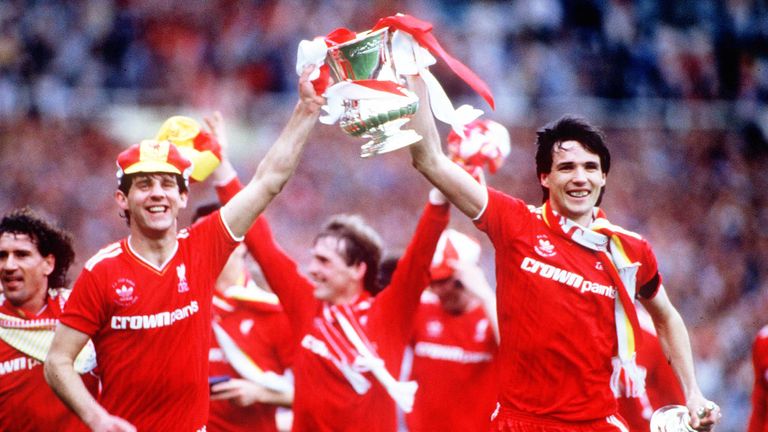 Alan Hansen (left) and Jim Beglin parade the FA Cup after Liverpool's victory over Everton  in 1986.
Pic: Colorsport/Rex Features