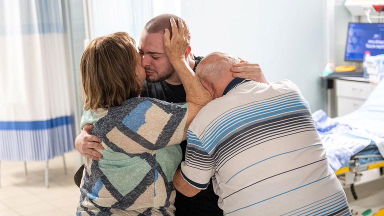 Rescued hostage Almog Meir Jan embraces loved ones. Pic: Reuters