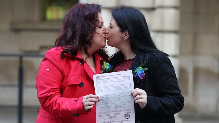 Amanda McGurk (left) and Cara McCann become the first same-sex couple to marry in Belfast after the law changed in February 2020. Pic: PA