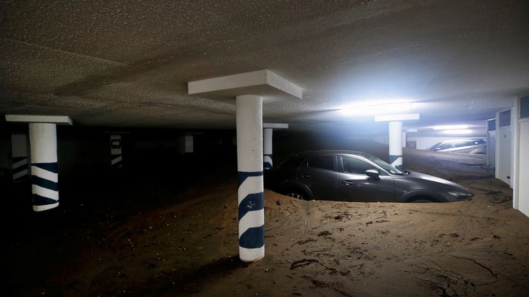 Cars stuck in an underground parking lot. Pic: Reuters
