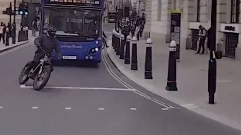 Moments before police knocked Stringer off his bike.  Photo: City of London Police