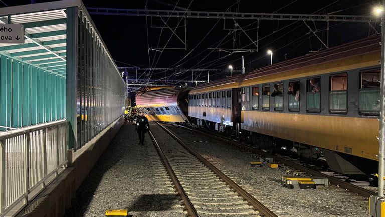 Emergency services respond to the scene following a collision between a passenger train and a freight train in Pardubice, Czech Republic. Pic: Reuters