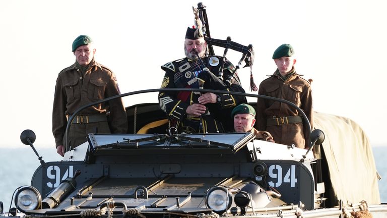 Pic: PA
A military piper comes into shore on a DUKW amphibious vehicle ahead of playing a dawn lament on Gold Beach in Arromanches in Normandy, France, to commemorate the 80th anniversary of the D-Day landings. Picture date: Thursday June 6, 2024.