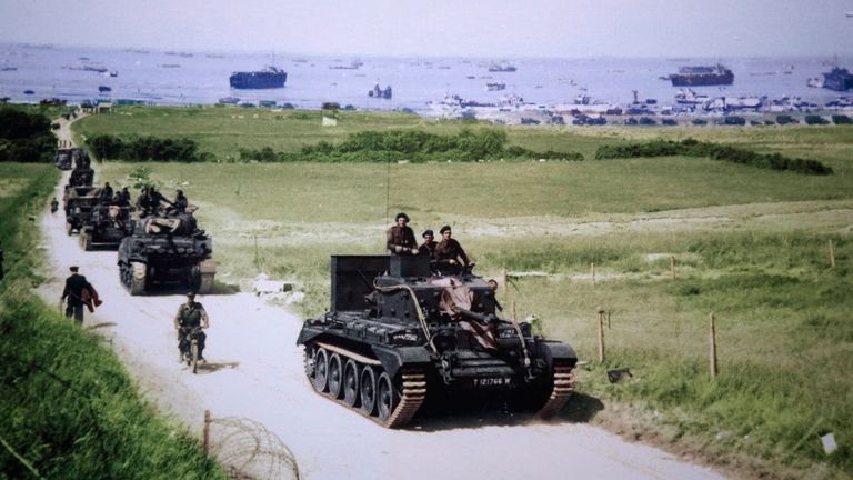 A Cromwell tank leads a British Army column from the 4th County of London Yeomanry, 7th Armoured Division, inland from Gold Beach after landing on D-Day in Ver-sur-Mer, France, on June 6, 1944 in this handout photo provided by the National Archives of Canada. On June 6, 1944, allied soldiers descended on the beaches of Normandy for D-Day - an operation that turned the tide of the Second World War against the Nazis, marking the beginning of the end of the conflict. Today, as many around the world