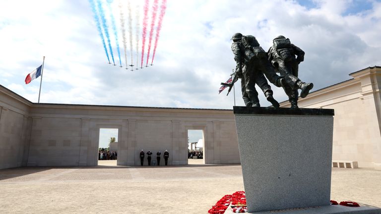 The Red Arrows doing a flypast over the British memorial event. Pic: PA 