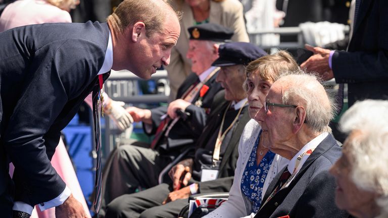 The prince spoke to several veterans at the anniversary event.  Photo: Reuters