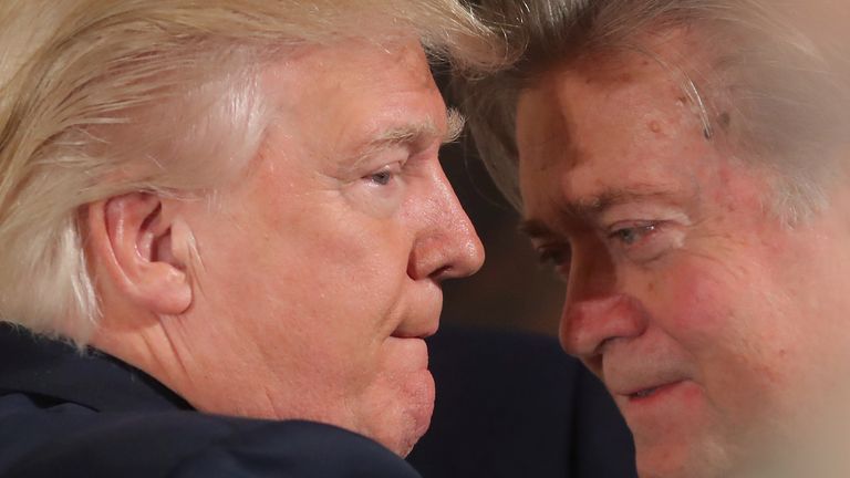 Donald Trump talks to Steve Bannon during a swearing in ceremony for senior staff at the White House in 2017. Pic: Reuters