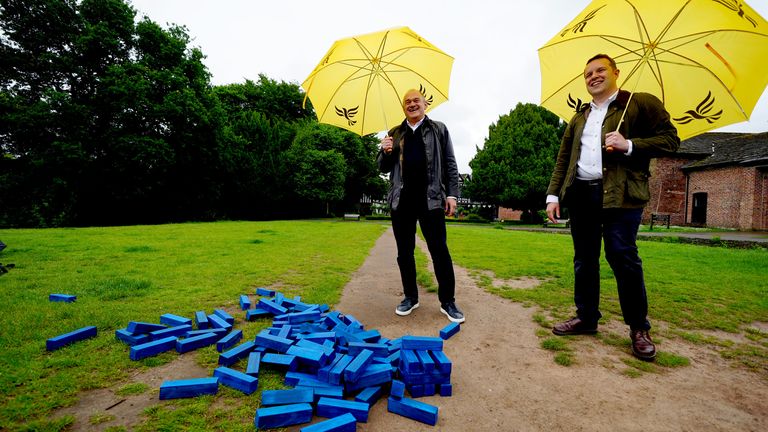 Ed Davey and Liberal Democrat Parliamentary Candidate for Cheadle Tom Morrison play Jenga during a visit to Cheadle.
Pic: PA
