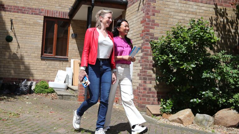 Susie Cleverly and Lucia Hunt in Fordham, Suffolk, while on the General Election campaign trail.
Pic: PA