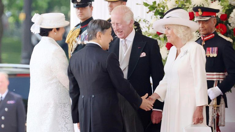 Japan&#39;s Emperor Naruhito (R, front) and Empress Masako (front, L) greet Britain&#39;s King Charles and Queen Camilla as they arrive at Horse Guards Parade in London on June 25, 2024, for the ceremonial welcome for the imperial couple&#39;s state visit to the country. (Pool photo) (Kyodo via AP Images) ==Kyodo