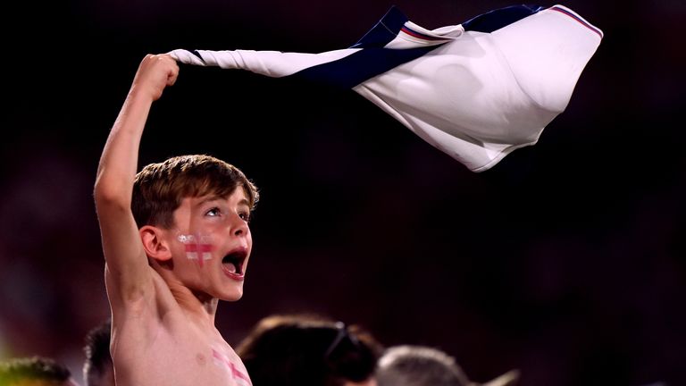 A young England fan stays motivated despite the Three Lions' performance. Pic: PA