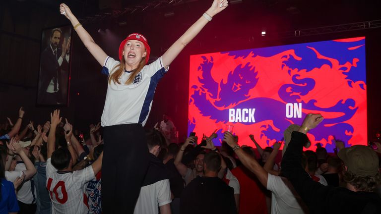 England fans celebrate at full-time at a fan zone in Manchester as England beat Slovakia. Pic: PA
