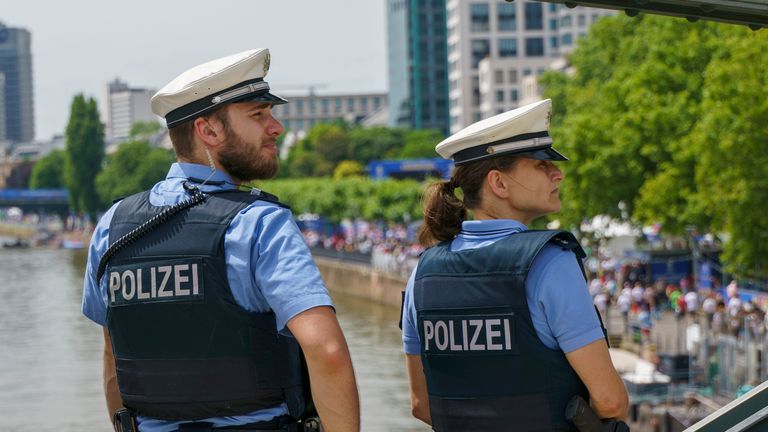 German police monitor fans from a bridge in Frankfurt Pic: AP