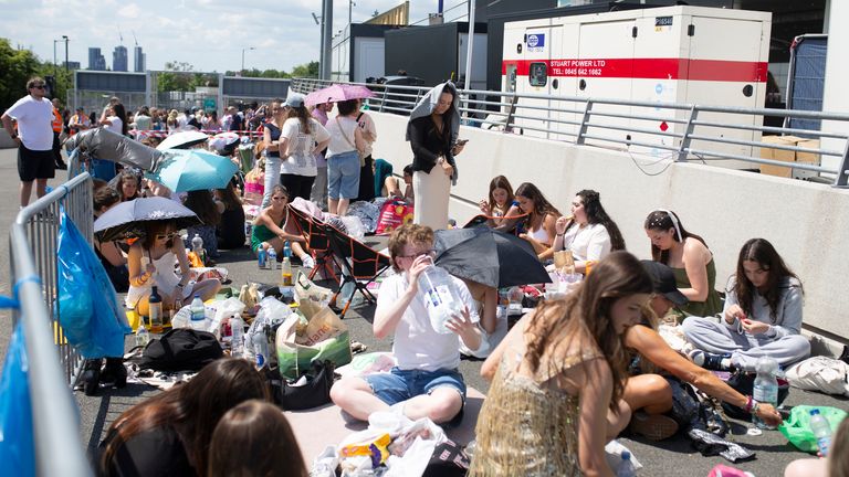 Fans wait outside Wembley Stadium in London, ahead of Taylor Swift's first London concert.
Pic: PA