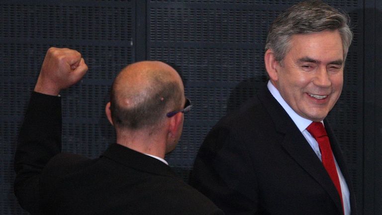 Derek Jackson gesturing behind Gordon Brown. Pic: PA