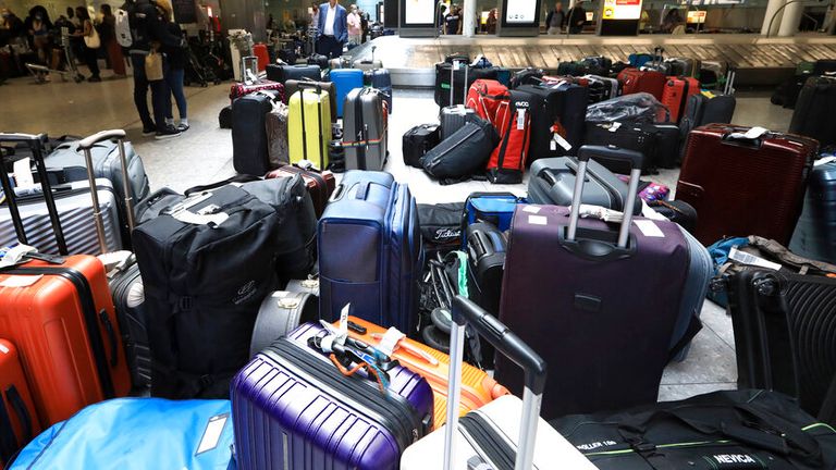Lots of unpicked baggage are left at an arrival lobby of Heathrow Airport (LHR) in London, United Kingdom on June 25, 2022. At Heathrow Airport, the management system broke down and a large amount of luggage has been left unattended. There were a series of flight delays and cancellations. One of the reasons is that many employees were dismissed due to the new coronavirus COVID-19. ( The Yomiuri Shimbun via AP Images )