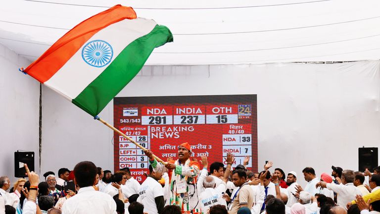 Indian National Congress (INC) supporters react to initial general election results at the party headquarters, in New Delhi.
Pic: Reuters