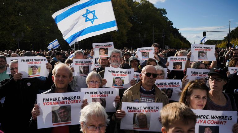 People hold posters of Israelis held hostage by Hamas in a demonstration against antisemitism in Berlin in October 2023. Pic: AP