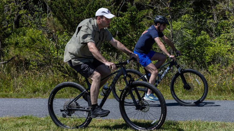 U.S. President Joe Biden and his son Hunter Biden go for a bike ride in Rehoboth Beach, Delaware, U.S., June 1, 2024. REUTERS/Anna Rose Layden