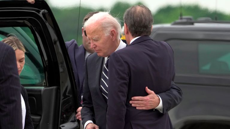 Joe Biden greets his son Hunter Biden at Delaware Air National Guard Base.
Pic: AP