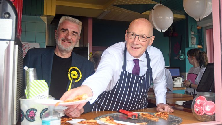 John Swinney joins SNP candidate Tommy Sheppard and serves pizza at Portobello Beach and Promenade. Pic: PA