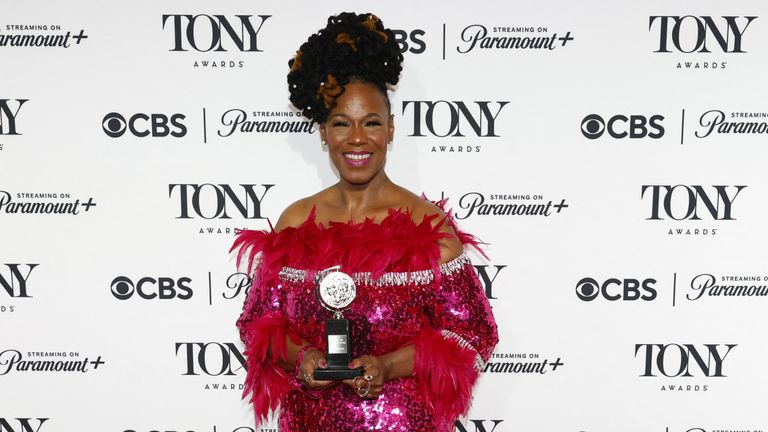 Kecia Lewis poses with the award for Best Performance by a Featured Actress in a Musical for 