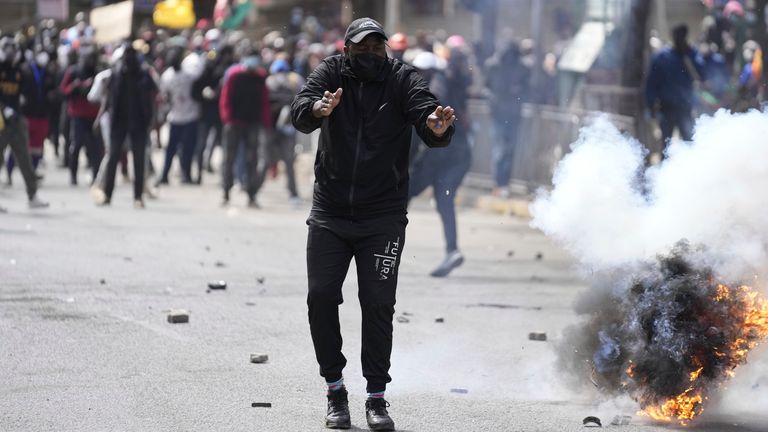 Protesters scatter as police fire teargas at them during a protest over proposed tax hikes in a finance bill in downtown Nairobi, Kenya Tuesday, June. 25, 2024. (AP Photo/Brian Inganga) pic: AP