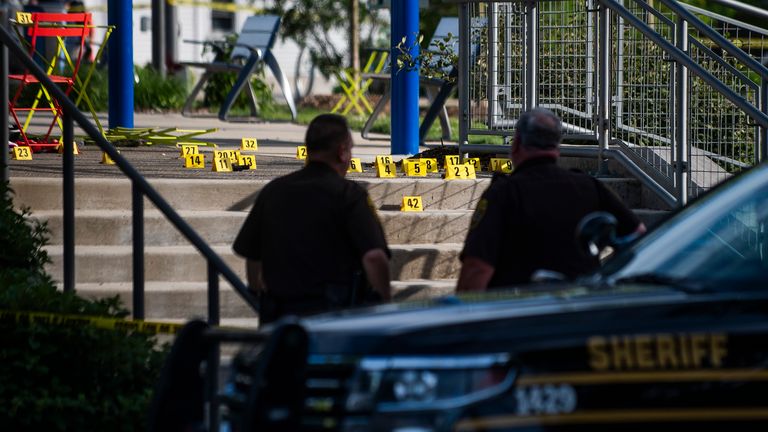 Officials with the Oakland County Sheriff's Department, Rochester Hills Fire Department and other jurisdictions secure the scene of a shooting at the Brooklands Plaza Splash Pad, Saturday, June 15, 2024, in Rochester Hills, Mich. (Katy Kildee/Detroit News via AP)