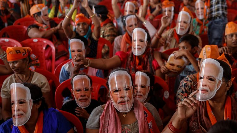 Pic: Reuters Supporters of India's Prime Minister Narendra Modi wear masks of his face, as they attend an election campaign rally in Meerut, India, March 31, 2024. 