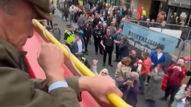A protester hurled things from a construction site, including a coffee cup, at Nigel Farage in Barnsley town centre.