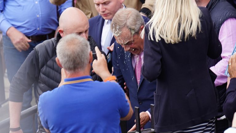 Nigel Farage has a drink thrown over him as he leaves the Moon and Starfish pub.
Pic: PA