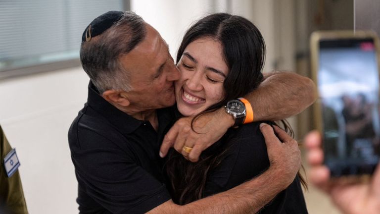 Rescued hostage Noa Argamani embraces her father Yakov. Pic: Reuters