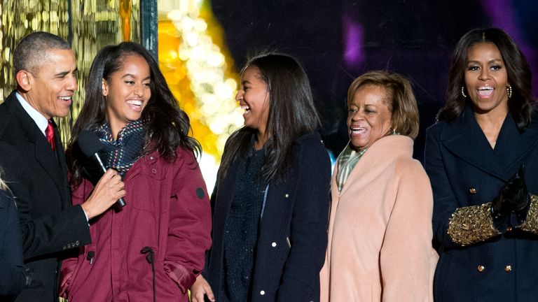 President Barack Obama, left, with daughters Malia and Sasha, mother-in-law Marian Robinson and first lady Michelle Obama sing onstage during the National Christmas Tree Lighting ceremony at the Ellipse in Washington, Thursday, Dec. 3, 2015. Also on stage is actress Reese Witherspoon at left. (AP Photo/Pablo Martinez Monsivais)


