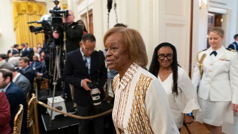 FILE - Former first lady Michelle Obama's mother Marian Robinson, center, arrives for a ceremony as President Joe Biden and first lady Jill Biden host former President Barack Obama and Michelle Obama for the unveiling of their official White House portraits in the East Room of the White House in Washington, Sept. 7, 2022. Robinson, who moved with the first family to the White House when son-in-law Barack Obama was elected president, has died, according to an announcement by Michelle Obama and other family members Friday, May 31, 2024. (AP Photo/Andrew Harnik, File)